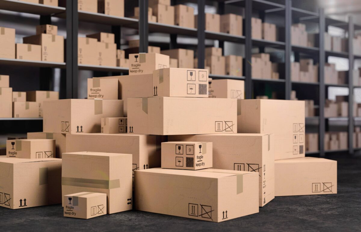 Stacked cardboard boxes in a warehouse, representing logistics and shipping operations