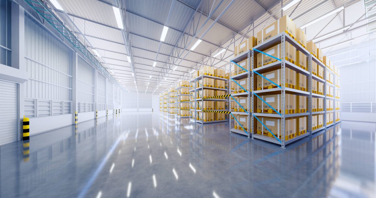 Interior of a modern warehouse with high shelves stocked with boxes, representing efficient storage and logistics solutions.